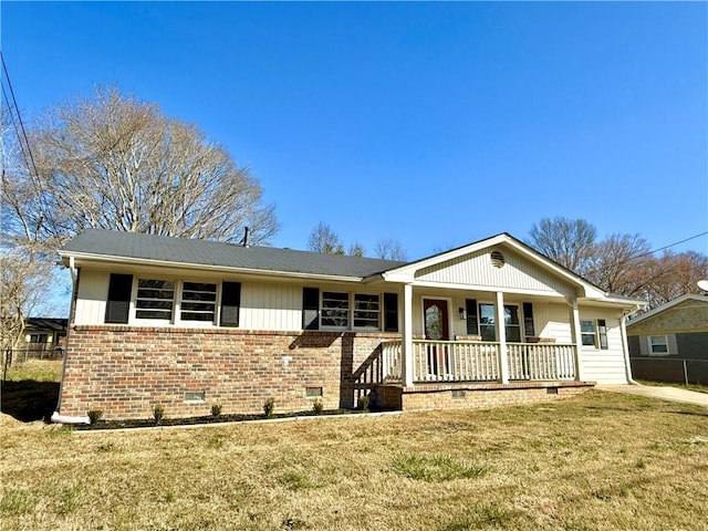 ranch-style home with a porch, crawl space, a front yard, and brick siding