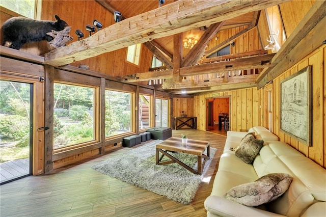 living room featuring high vaulted ceiling and a wealth of natural light