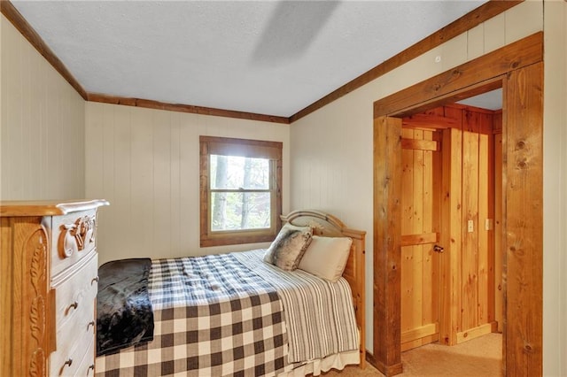 bedroom featuring ornamental molding and light colored carpet