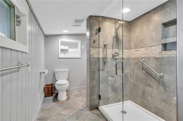 bathroom featuring tile flooring, an enclosed shower, toilet, and ornamental molding