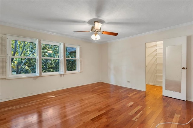 270 Lakemoore Dr NE Unit B, Atlanta, GA 30342 - spare room with hardwood / wood-style floors, ornamental molding, ceiling fan, and a textured ceiling