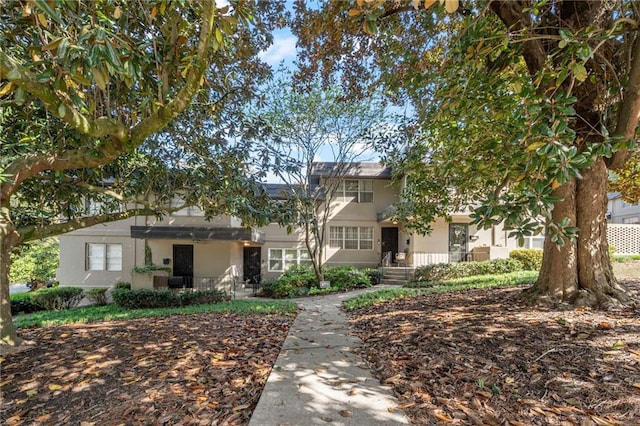 270 Lakemoore Dr NE Unit B, Atlanta, GA 30342 - view of front of property featuring stucco siding and covered porch