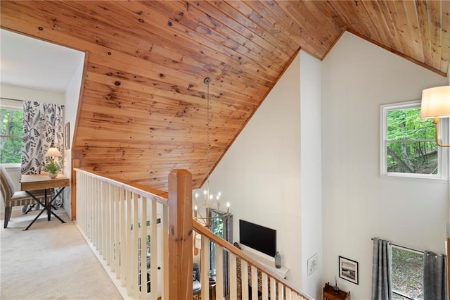 367 Windflower Dr, Big Canoe, GA 30143 - hall featuring wooden ceiling, vaulted ceiling, a chandelier, carpet floors, and an upstairs landing