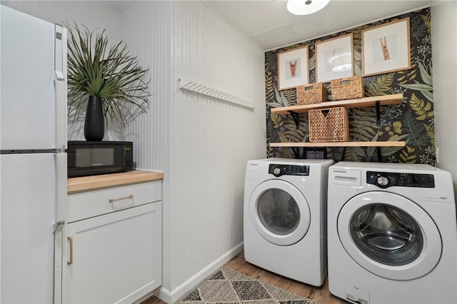 367 Windflower Dr, Big Canoe, GA 30143 - laundry area with light wood-type flooring, washer and dryer, and wallpapered walls