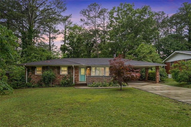 890 Oriole Ln SE, Marietta, GA 30067 - ranch-style home with concrete driveway, a lawn, brick siding, and an attached carport