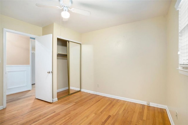 890 Oriole Ln SE, Marietta, GA 30067 - unfurnished bedroom featuring light wood finished floors, a closet, baseboards, and ceiling fan