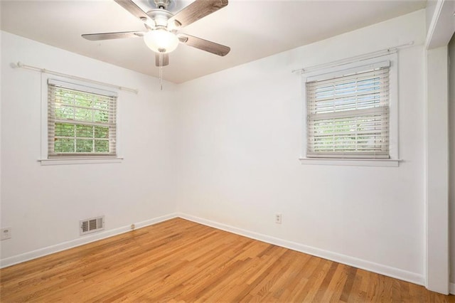 890 Oriole Ln SE, Marietta, GA 30067 - spare room featuring light wood-style floors, baseboards, and a ceiling fan