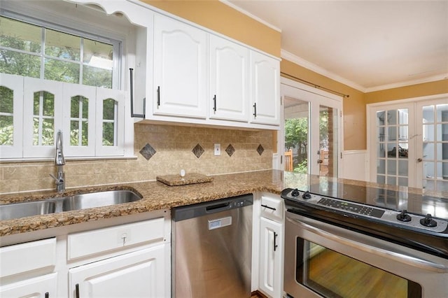 890 Oriole Ln SE, Marietta, GA 30067 - kitchen featuring stainless steel appliances, french doors, a sink, light stone counters, and white cabinets
