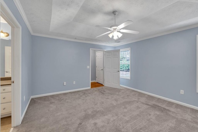 unfurnished bedroom with baseboards, carpet flooring, and a textured ceiling