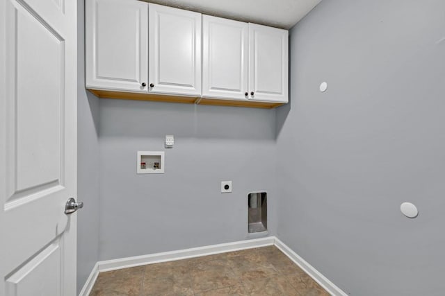laundry area with baseboards, hookup for a washing machine, cabinet space, and hookup for an electric dryer