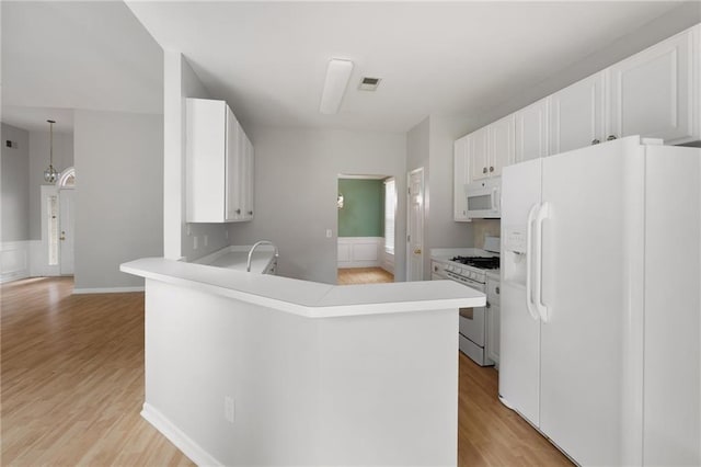 4801 Devonhurst Way, Powder Springs, GA 30127 - kitchen with white appliances, light wood-type flooring, white cabinets, and light countertops