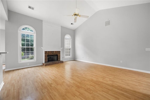 4801 Devonhurst Way, Powder Springs, GA 30127 - unfurnished living room with light wood finished floors, ceiling fan, a fireplace, high vaulted ceiling, and baseboards