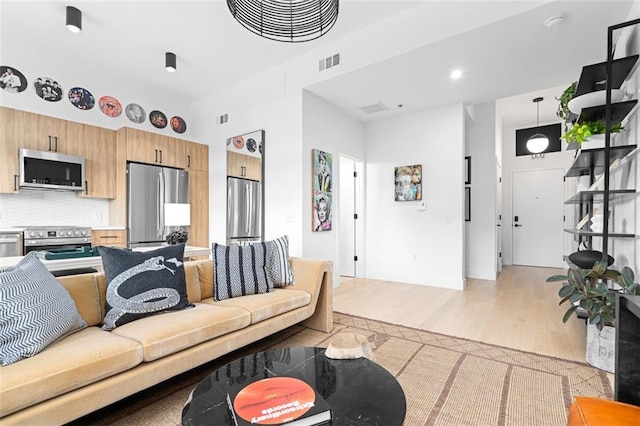 567 Ponce De Leon Ave NE Unit 321, Atlanta, GA 30308 - living room with light wood-type flooring