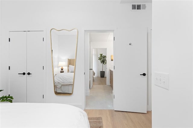567 Ponce De Leon Ave NE Unit 321, Atlanta, GA 30308 - bedroom with light wood-style flooring and a closet