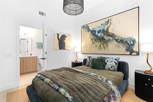 567 Ponce De Leon Ave NE Unit 321, Atlanta, GA 30308 - bedroom with ensuite bathroom, a sink, and baseboards
