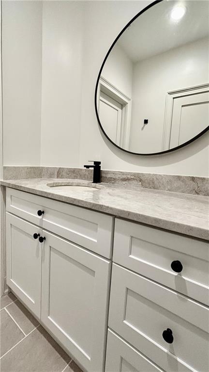 bathroom with vanity and tile patterned floors