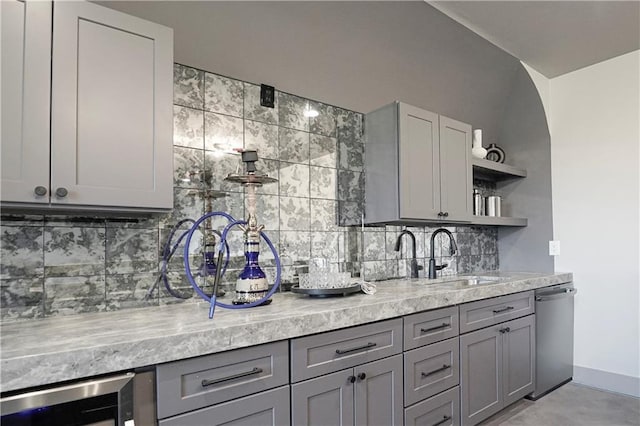 kitchen with open shelves, a sink, gray cabinetry, wine cooler, and stainless steel dishwasher