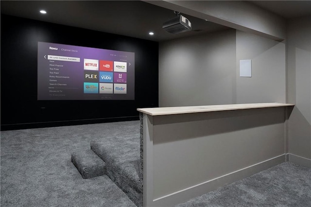 carpeted cinema room with recessed lighting