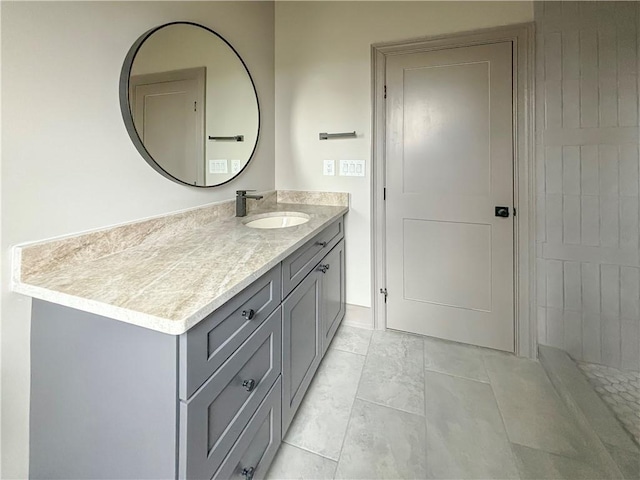 bathroom with vanity and marble finish floor