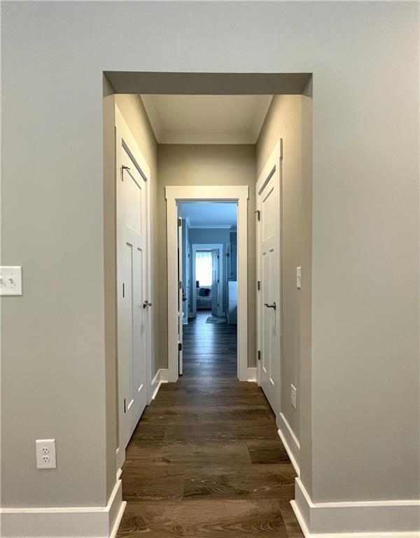520 Stoneledge Dr, Jasper, GA 30143 - hall with baseboards, crown molding, and dark wood finished floors