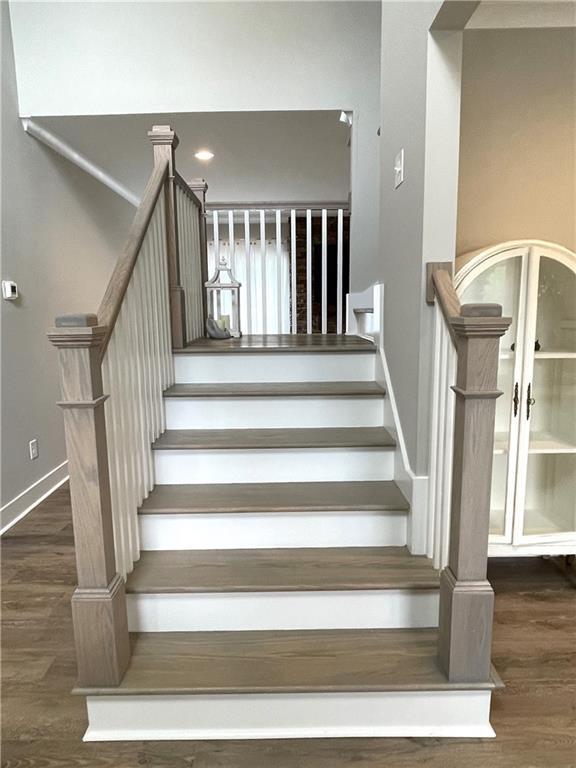 staircase featuring hardwood / wood-style flooring