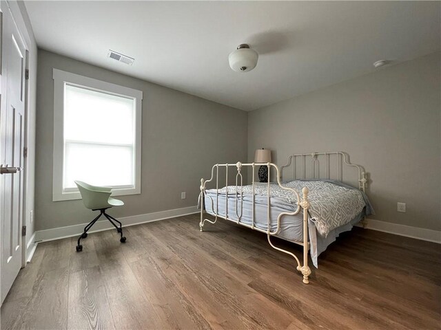 bedroom featuring hardwood / wood-style flooring