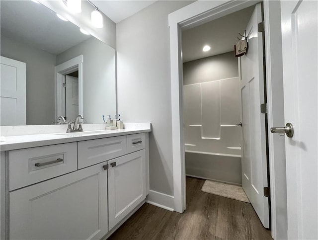 520 Stoneledge Dr, Jasper, GA 30143 - full bathroom with washtub / shower combination, baseboards, wood finished floors, and vanity