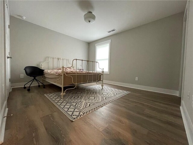 bedroom featuring dark wood-type flooring