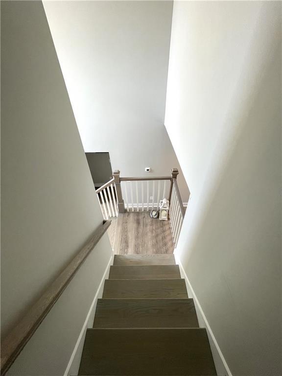 stairs with wood-type flooring