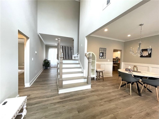 520 Stoneledge Dr, Jasper, GA 30143 - entrance foyer featuring visible vents, ornamental molding, wood finished floors, and an inviting chandelier