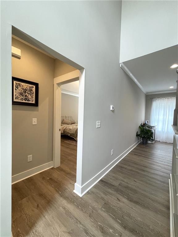 hall with dark hardwood / wood-style flooring