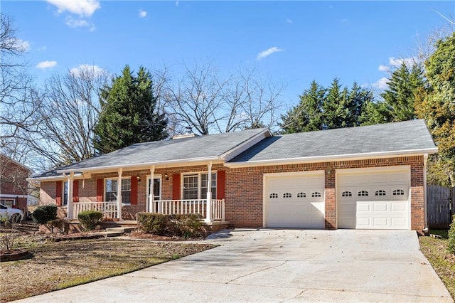 single story home with a porch and a garage