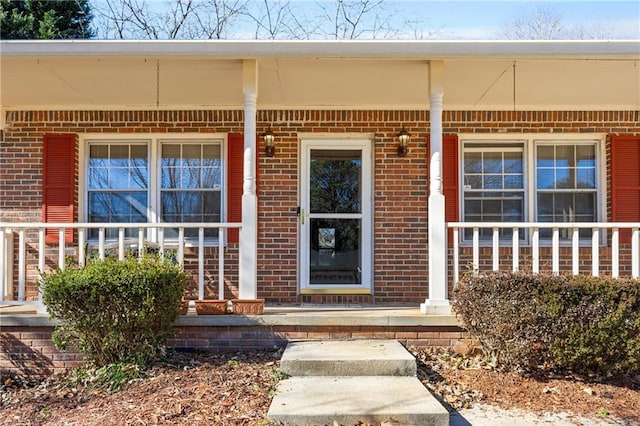 doorway to property featuring covered porch