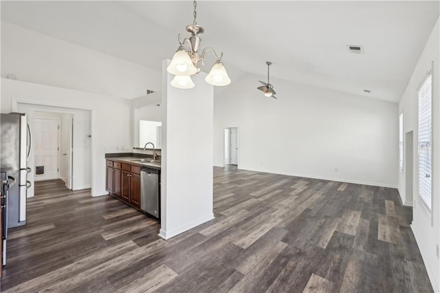 kitchen featuring dark wood-style floors, stainless steel appliances, a sink, and visible vents