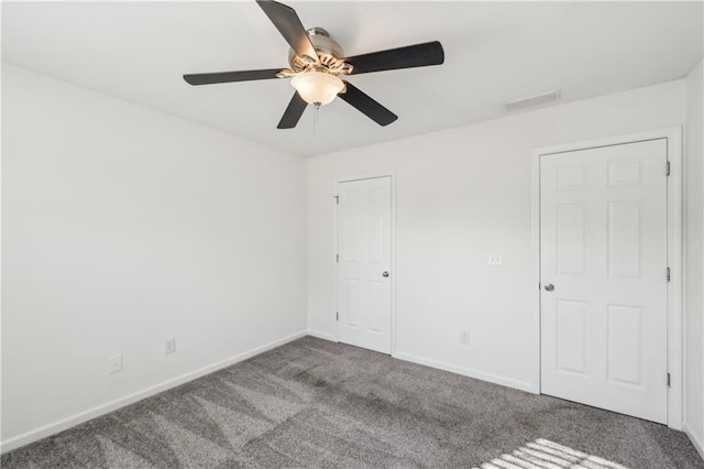 unfurnished bedroom featuring a ceiling fan, baseboards, visible vents, and carpet flooring