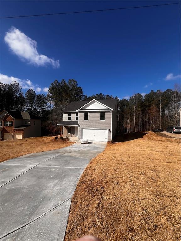 view of front of property with a garage