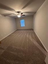 spare room featuring carpet floors and ceiling fan