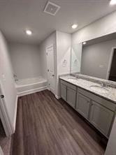 bathroom featuring hardwood / wood-style flooring and vanity