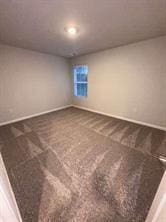 spare room featuring carpet