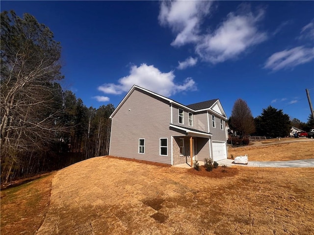 view of side of home with a garage