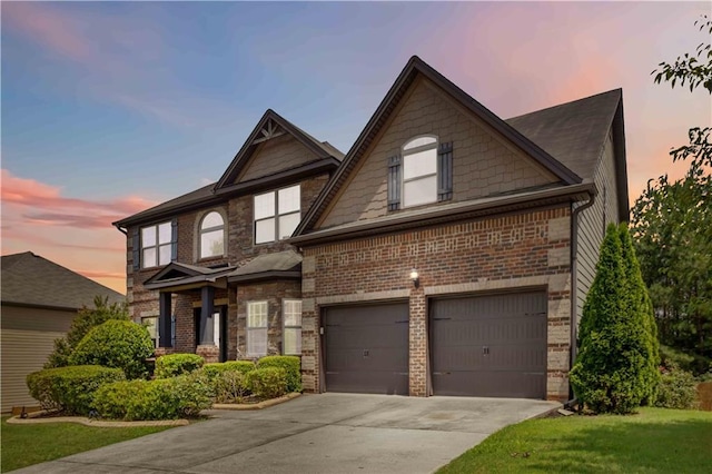 4249 Caveat Ct, Fairburn, GA 30213 - view of front of home with driveway, brick siding, an attached garage, and a lawn