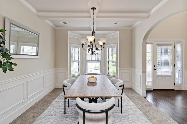 4249 Caveat Ct, Fairburn, GA 30213 - dining space featuring arched walkways, beam ceiling, coffered ceiling, wainscoting, and a decorative wall