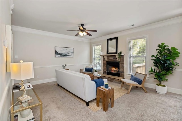 4249 Caveat Ct, Fairburn, GA 30213 - carpeted living room with a stone fireplace, ornamental molding, and ceiling fan