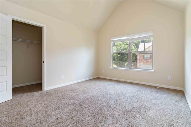4249 Caveat Ct, Fairburn, GA 30213 - unfurnished bedroom with vaulted ceiling, carpet flooring, a spacious closet, and a closet