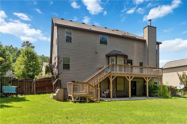 4249 Caveat Ct, Fairburn, GA 30213 - rear view of house featuring a wooden deck, a patio, a chimney, stairs, and a gate