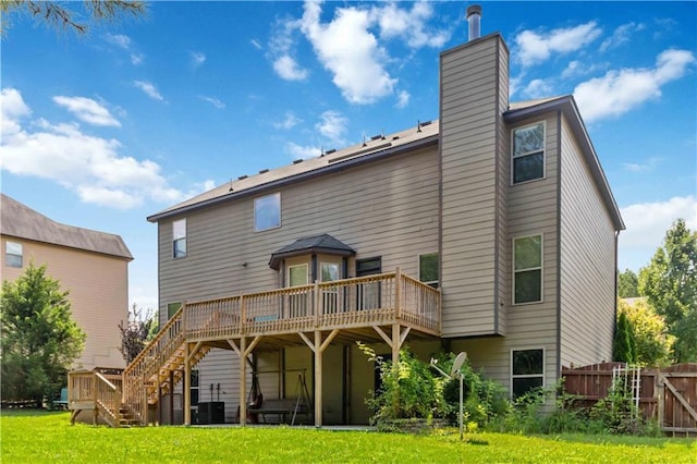 4249 Caveat Ct, Fairburn, GA 30213 - back of house featuring a wooden deck, stairs, and a chimney