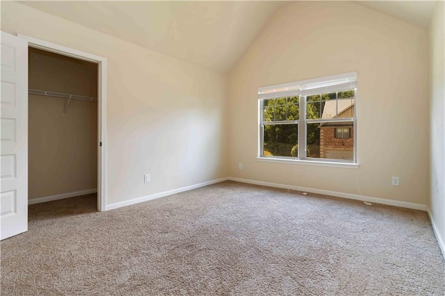4249 Caveat Ct, Fairburn, GA 30213 - unfurnished bedroom with lofted ceiling and carpet flooring