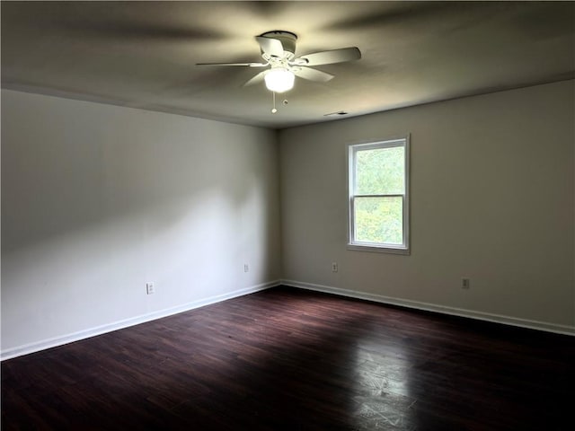 210 Ormond St SW, Atlanta, GA 30315 - empty room with a ceiling fan, baseboards, and dark wood finished floors