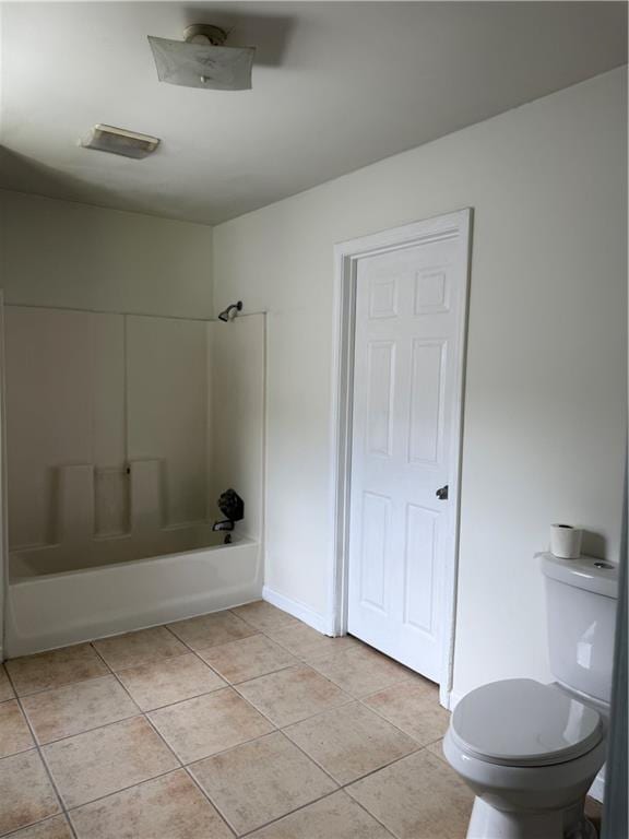 210 Ormond St SW, Atlanta, GA 30315 - bathroom featuring toilet, shower / bath combination, tile patterned floors, and baseboards