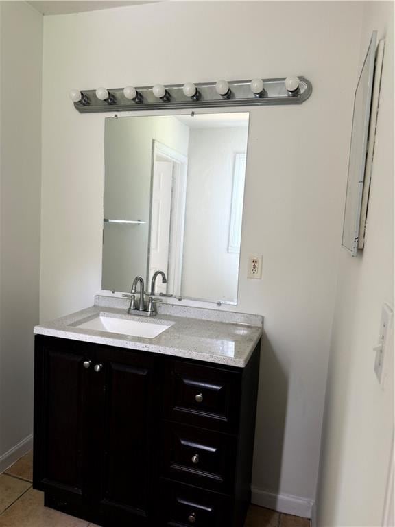 210 Ormond St SW, Atlanta, GA 30315 - bathroom featuring vanity, tile patterned flooring, and baseboards